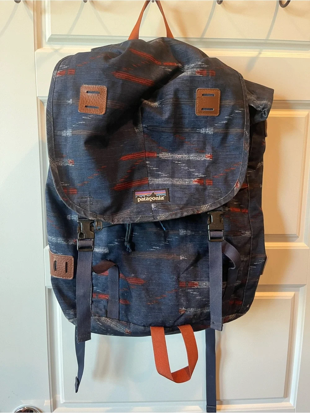 Patagonia Navy Blue Patterned Daypack with Rust Accents.  25L